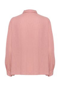 Camicia rosa chiaro a maniche lunghe con colletto classico, caratterizzata da una vestibilità rilassata e dettagli con bottoni ai polsini e ai lati.
