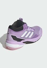 Purple athletic shoe with a mesh upper, white three-stripe design, black accents, and a rubber sole. Features a padded collar and tongue.