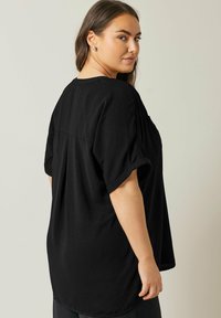 Evans OVERHEAD UTILITY - Tunica - black