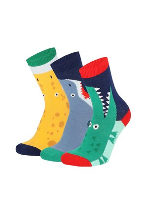 Three colorful children's socks with animal designs: yellow giraffe, blue shark, and green crocodile with red, blue, and green accents.