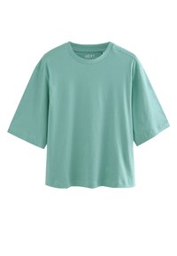 Tricou cu mâneci scurte, verde mentă, realizat din bumbac moale, cu croială lejeră și decolteu rotund, cu umeri ușor căzuți.