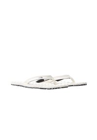 White flip-flops with a ribbed textured sole, featuring black speckled accents. Thin straps overlay with a logo detail on one side.