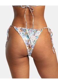 Floral print bikini bottom with adjustable tie sides, featuring a colorful pattern on a light background, made from smooth fabric.