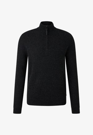 Sort ribbet striktrøje med lange ærmer og en kvart lynlås ved den høje krave.
