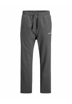 Pantalons de survêtement gris en tissu doux, avec une taille élastique et un cordon de serrage, des poches latérales et un logo discret sur le devant.