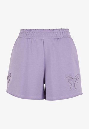 Lila pamut szoknya elasztikus derékpánttal, bal lábán pillangó hímzéssel és sima textúrával.