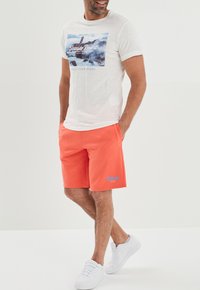 Creeks AMERICAN INSPIRATION; FASHION; COOL; EASY STRAIGHT - Jogginghose - light orange