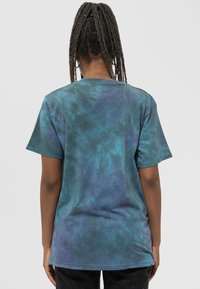 Short-sleeve cotton t-shirt in a tie-dye pattern featuring shades of blue and green, crew neckline, and relaxed fit.