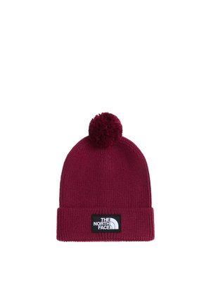 Ciemnoczerwona dziana czapka z pomponem na górze i czarno-białą naszywką z logo The North Face na mankiecie.