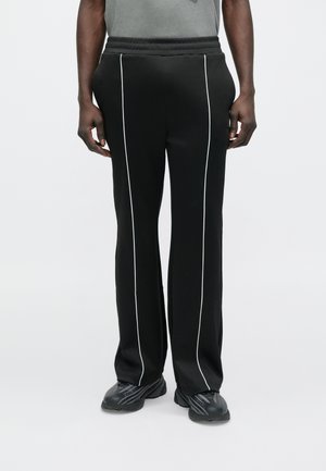 LOCKING - Pantalones deportivos - black