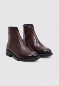 Brown leather ankle boots with a smooth finish, featuring a side zipper and a rectangular block heel. Rounded toe design.
