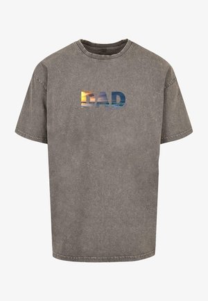 Gray cotton t-shirt with a crew neck and short sleeves. Features the word "DAD" in a gradient ocean sunset print across the front.