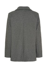 Grå blazer med hundetandsmønster, lange ærmer og bukket revers, vist bagfra på hvid baggrund.