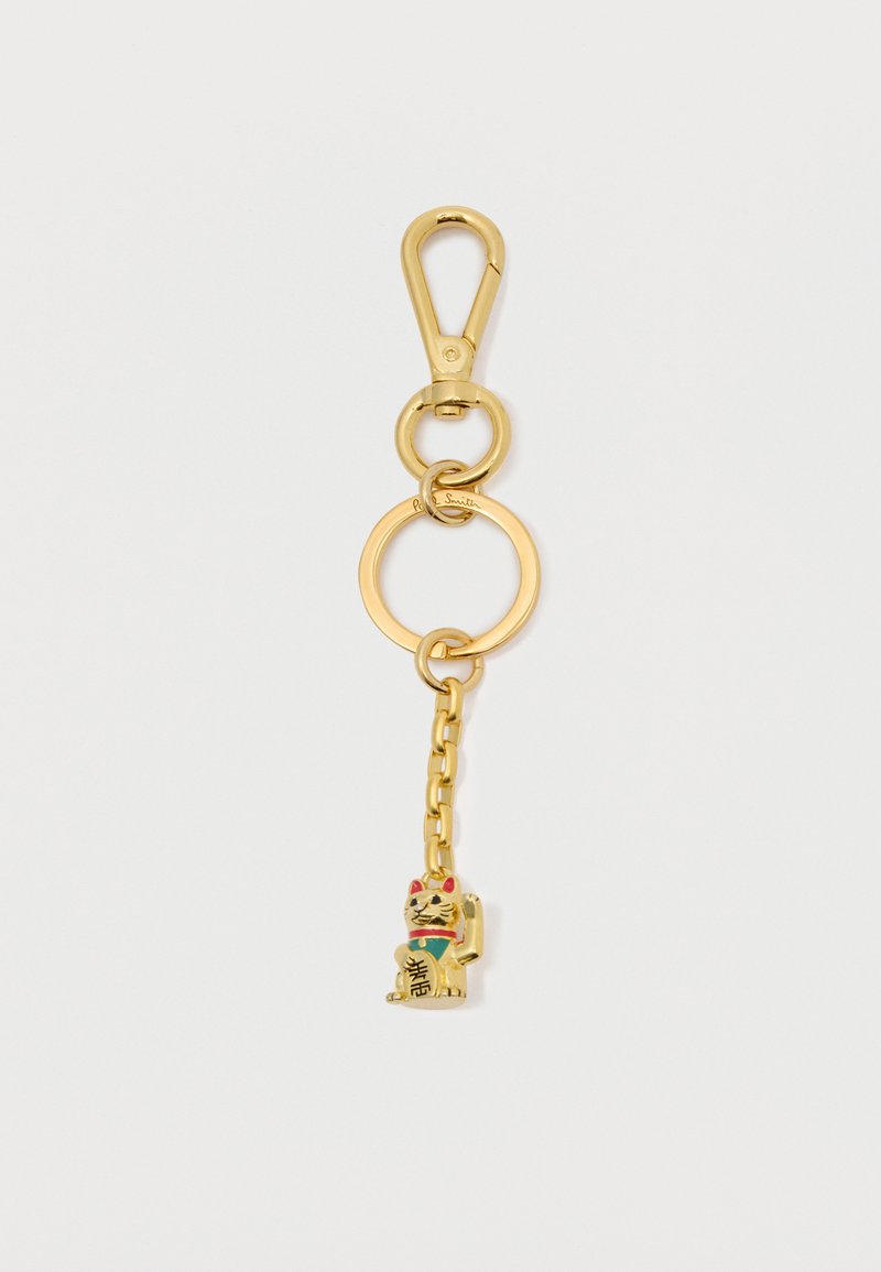 Portachiavi d'oro con un gancio, una catena decorativa e un charm a forma di gatto con accenti colorati e una scritta alla base.