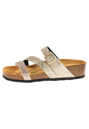 Glittery gold and silver cross-strap sandals with a cork platform, textured straps, and a buckle accent. Black rubber outsole.
