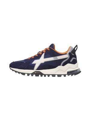 Navy blue sneaker with white side logo, orange laces, padded collar, rugged black sole, and visible air cushion on heel.