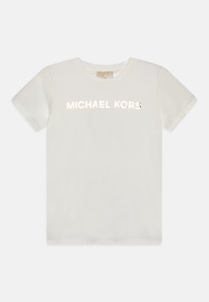 T-shirt en coton blanc avec des manches courtes et un col rond. Le devant affiche "MICHAEL KORS" en lettres réfléchissantes et en gras.