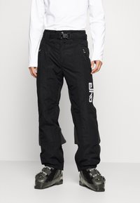Zwarte sneeuwbroeken met een gestructureerde afwerking, uitgerust met een getailleerde tailleband, een verstelbare riem en zijzakken met rits. Logo-detail op het been.