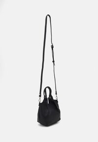 Black leather handbag with a textured surface, featuring two handles and a detachable shoulder strap. Compact and structured design.