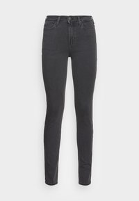 Jeans skinny de mezclilla negra con cintura alta, cinco bolsillos y cierre de botón. Textura suave y ajuste estrecho en las piernas.
