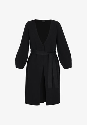 Black, long-sleeve wrap dress in a smooth fabric with a deep V-neck, a belt at the waist, and a thigh-high slit on the front.