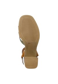 Tan and green sandal sole, featuring rubber material, flat design, textured surface with grooves, and a squared heel shape.