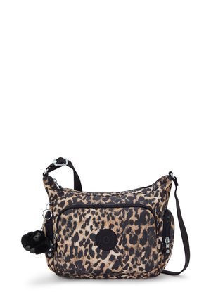 Leopard print crossbody bag made of fabric, featuring a black logo, two zippered pockets, and a detachable pom-pom keychain.