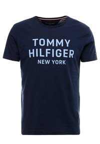 Navy cotton t-shirt with short sleeves. Features light blue text "TOMMY HILFIGER NEW YORK" on the front. Round neckline, soft texture.