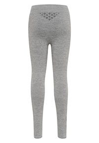 Grå leggings i mjukt tyg med en åtsittande design. Har ett triangulärt texturerat mönster på baksidan och en ankellång längd.