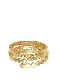 Anillos apilables de oro con diferentes texturas: retorcidos, con esferas y con patrones en zigzag, todos con un acabado pulido. Marcados con 925.