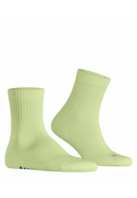 Jasnozielone skarpetki do kostki wykonane z gładkiego materiału, z prążkowanym mankietem. Posiadają niebieskie logo po boku oraz bezszwowy design palców.