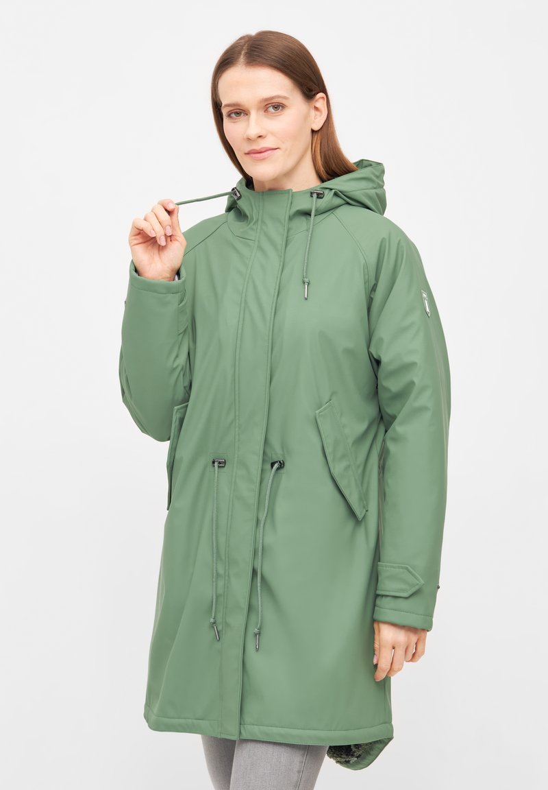 Green waterproof parka with a hood, cinched waist, side pockets, and silver hardware accents. Smooth texture with a straight cut design.