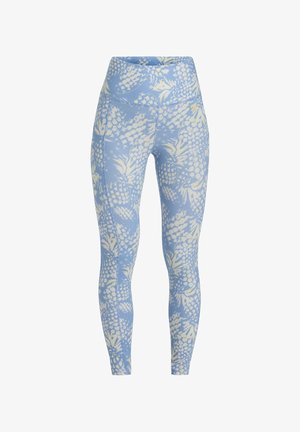 Leggings bleu clair avec un motif d'ananas blanc, taille haute, en tissu élastique, et design ajusté pour le confort et le mouvement.