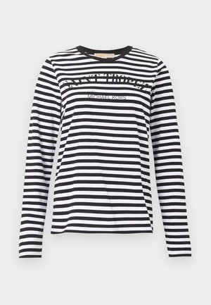 Musta-valkoraidallinen pitkähihainen paita, jossa edessä "SAINT TROPEZ" ja "MICHAEL KORS" -tekstit, pyöreä pääntie.