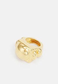 Neizvēlēts, gold-coloured