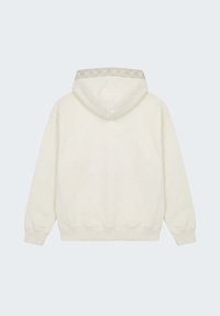 Sweat à capuche couleur crème avec manches longues et bordure à motif autour de la capuche, présenté de dos sur un fond uni.