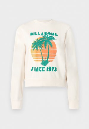 Felpa color crema con palme verdi su un cerchio arancione al tramonto, con le scritte "Billabong" e "Since 1973" sul davanti.