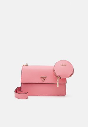 Pink crossbody bag with matching round coin pouch, both featuring gold zippers and Guess logo on front against a plain background.