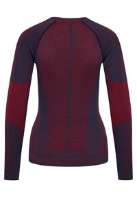 Pitkähihainen urheilupaita tummansinisenä, jossa on punaisia teksturoituja ilmanvaihtopaneeleja sekä saumaton neulekuvio selässä ja hihoissa.