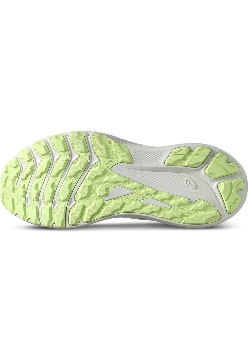Zool van een sneaker met een gestructureerde witte bovenkant en fel limoen groene rubberen buitenzool, met een golvend profiel voor grip.