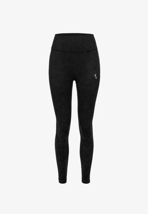 Čierne legíny s vysokým elastickým pásom, vyrobené z mäkkej textúrovanej tkaniny. Obsahujú jemné logo na ľavej nohe.