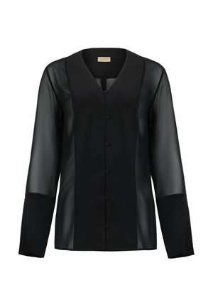 Svart blus med V-ringning, långa genomskinliga ärmar och knäppning framtill. Tillverkad av genomskinligt tyg med solida paneler vid axlarna.