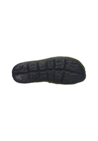 Sole of a shoe featuring a textured black rubber base with deep grooves, surrounded by a green felt edge for cushioning and warmth.
