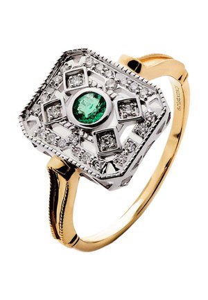 Anillo de oro con montaje rectangular de plata, con un esmeralda verde redondo central rodeado de diamantes en patrones geométricos.