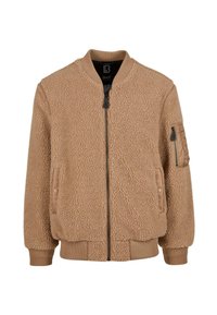 Beige bomberjack met een textuurrijke, pluizige fleece buitenkant. Voorzien van geribbelde boorden aan de mouwen en zoom, ritssluiting en een zak op de linkermouw.