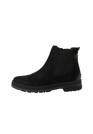 Sort ruskind ankleboot med elastiske sidepaneler, gummisål og trækstrop bagpå.