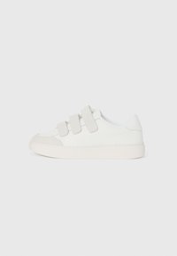 White sneaker with a smooth leather upper, three Velcro straps on the vamp, rounded toe, and a chunky light-colored rubber sole.
