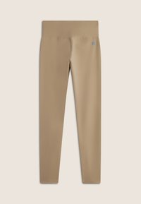 Leggings beige con una texture liscia e elastica. Vita alta e taglio slim. Piccolo logo sulla vita.