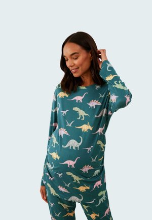 Set di pigiama a maniche lunghe in tessuto teal con stampe di dinosauri colorati in rosa, verde e giallo. Materiale morbido con vestibilità rilassata.
