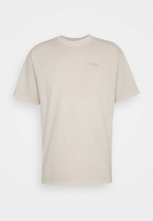 Beige cotton t-shirt with short sleeves, round neckline, and a subtle embroidered Levi's logo on the front. Soft texture, casual design.